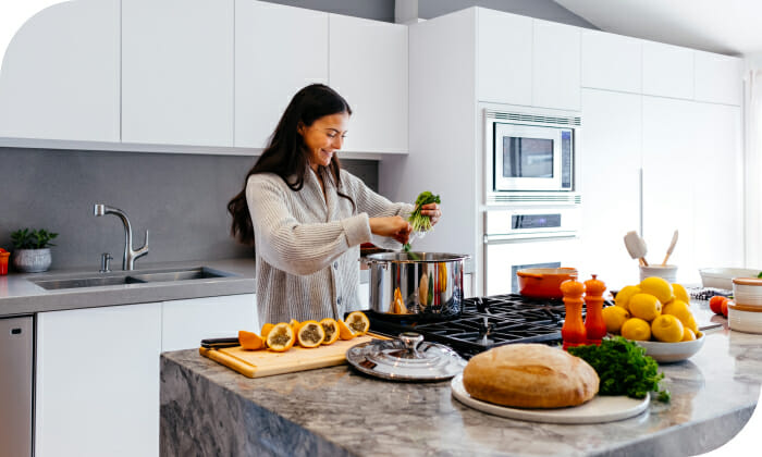 Woman Cooking in Kitchen